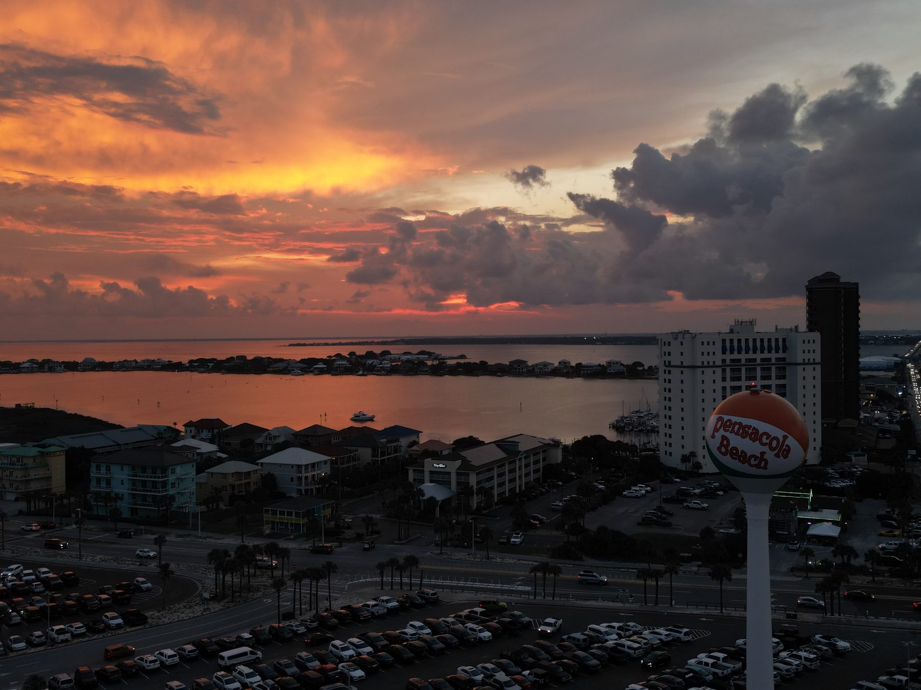 Golden storm clouds at sunset over Pensacola Beach, photographed by drone