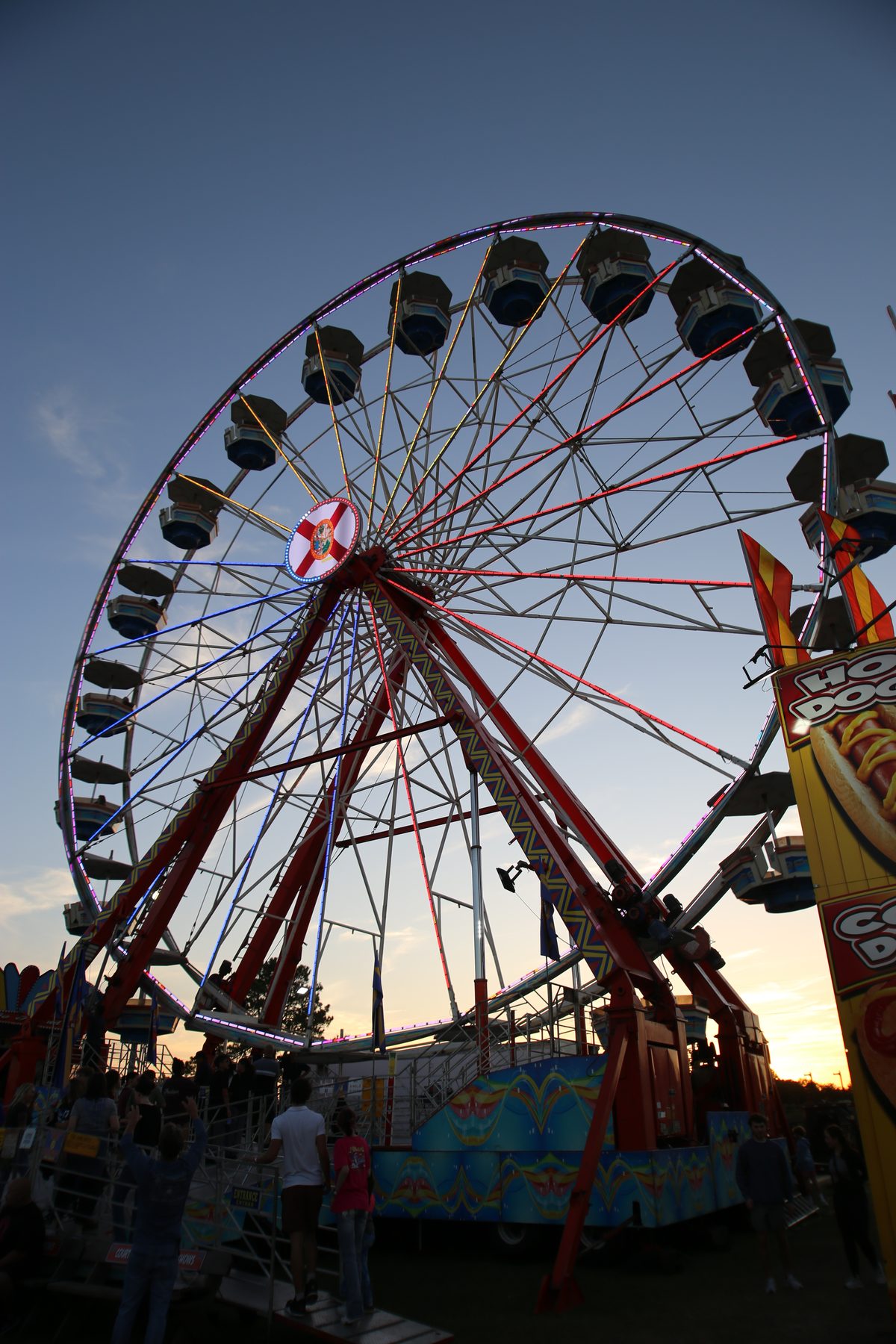 Ferris wheel against a dusk sky at a Gulf Coast fair