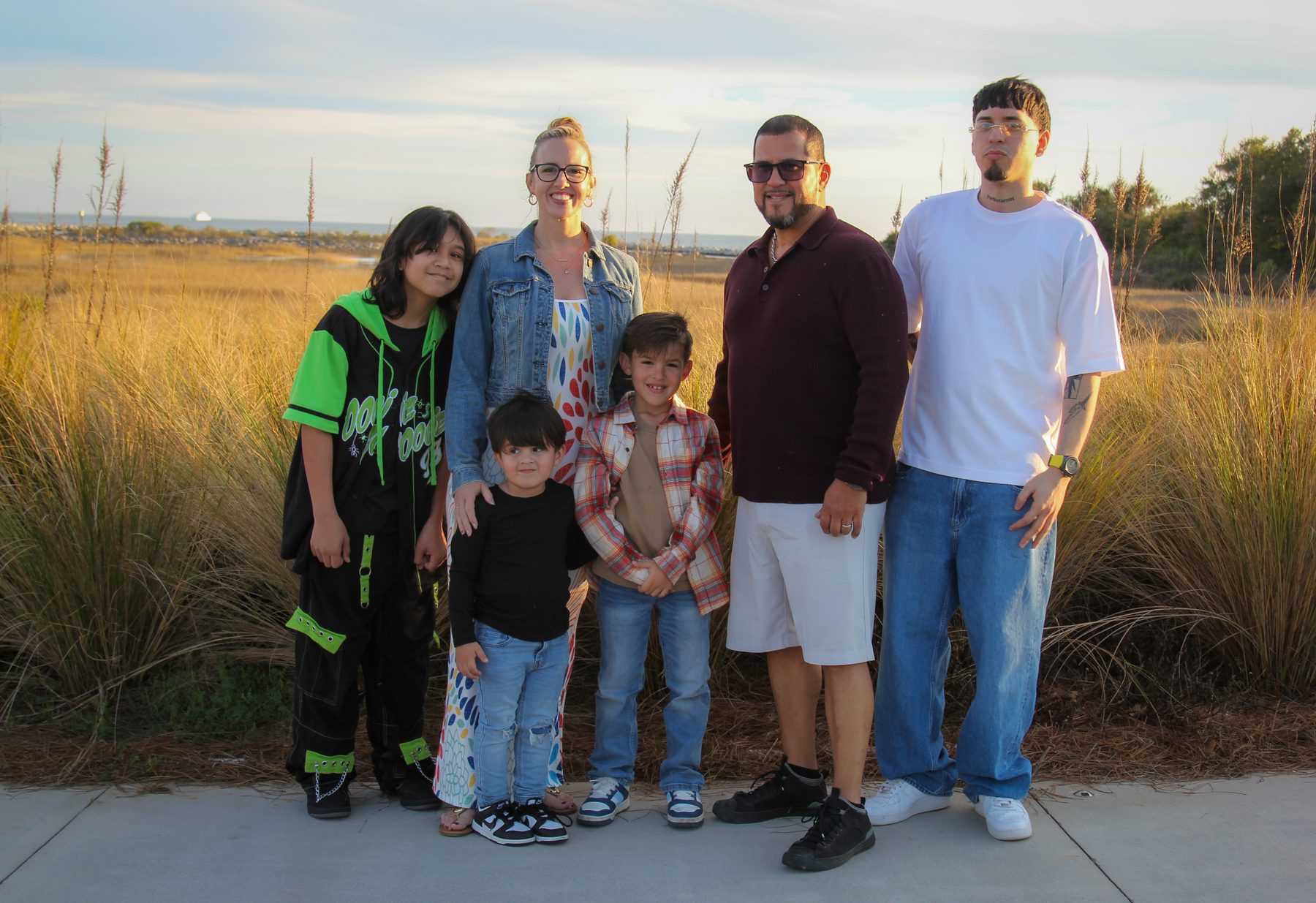 Extended family portrait among golden marsh grass on the Gulf Coast