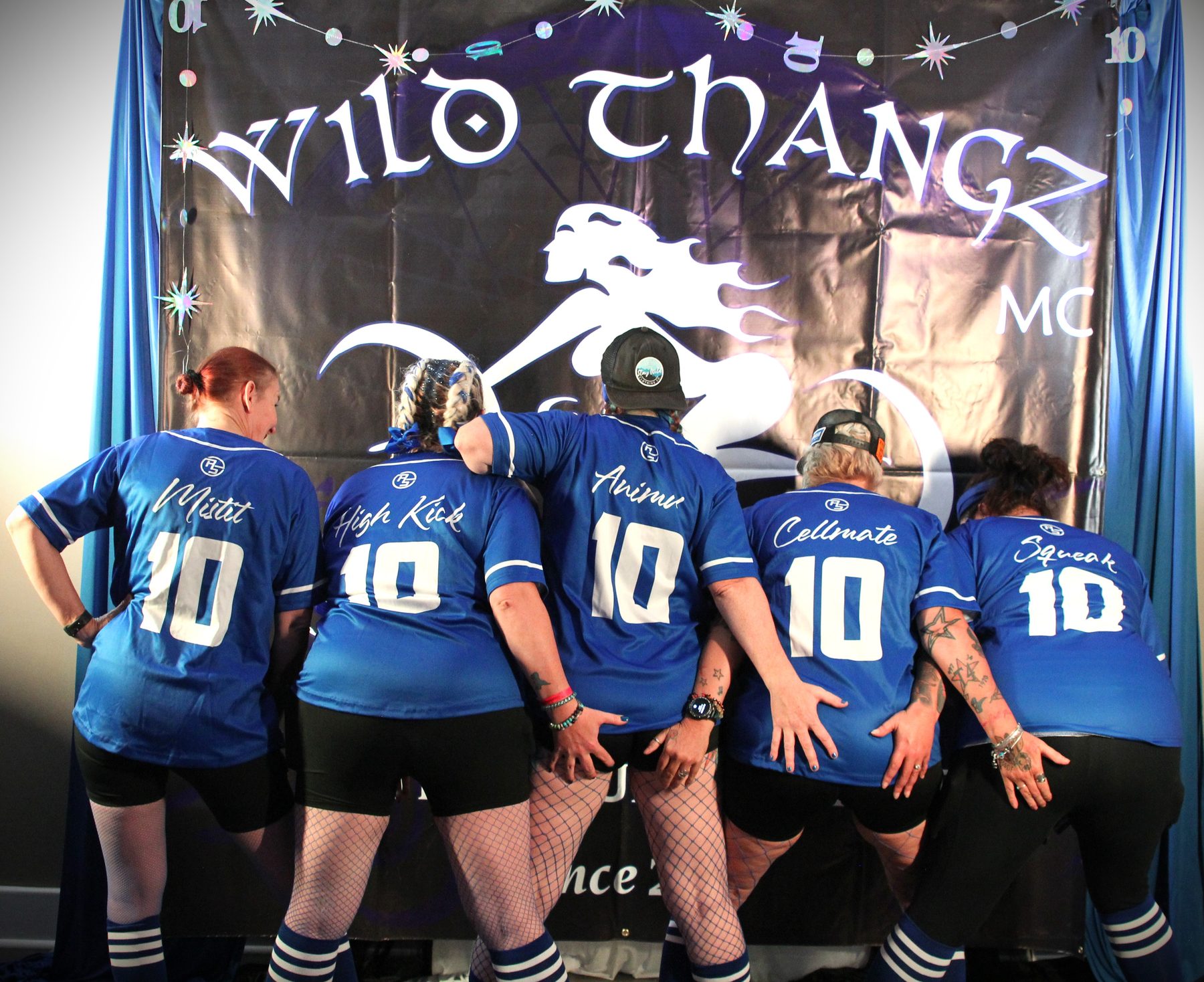Group in matching number 10 jerseys posing at a club celebration