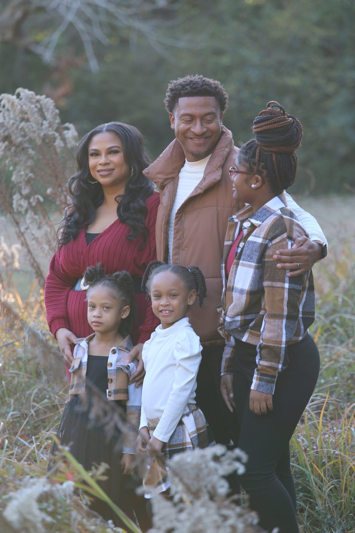 Multi-generation family portrait in autumn brush
