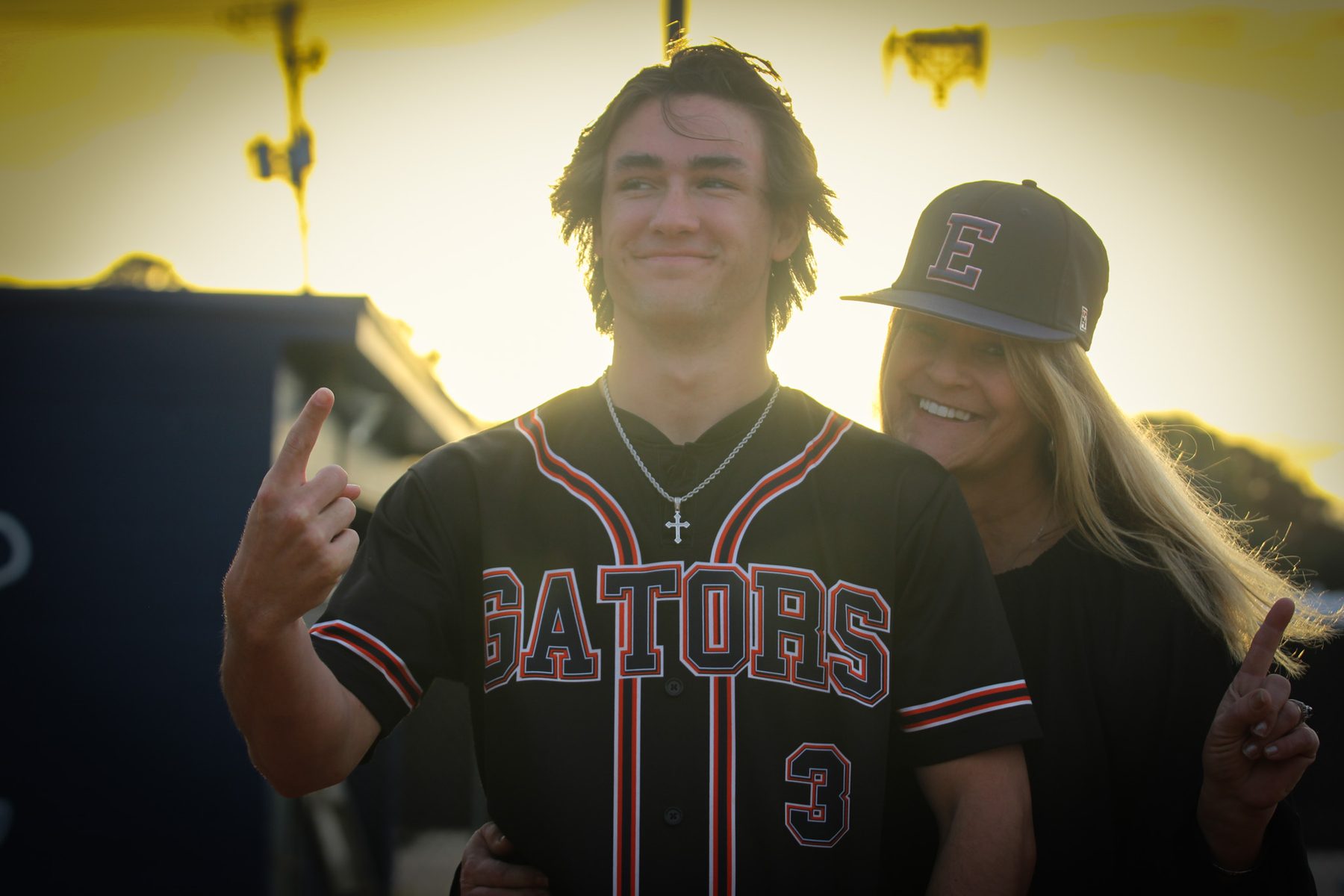 Fans in team jerseys celebrating at a baseball event